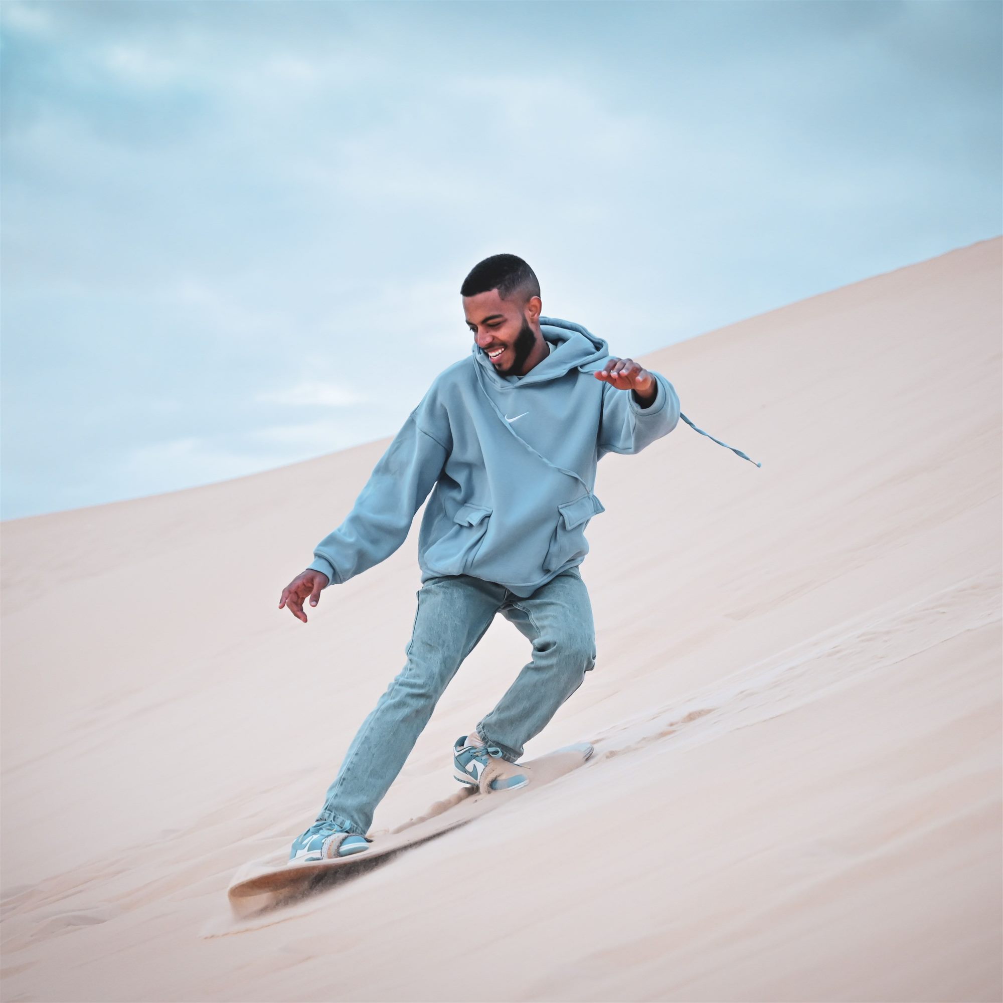 Sandboarding down the Timlaline dunes