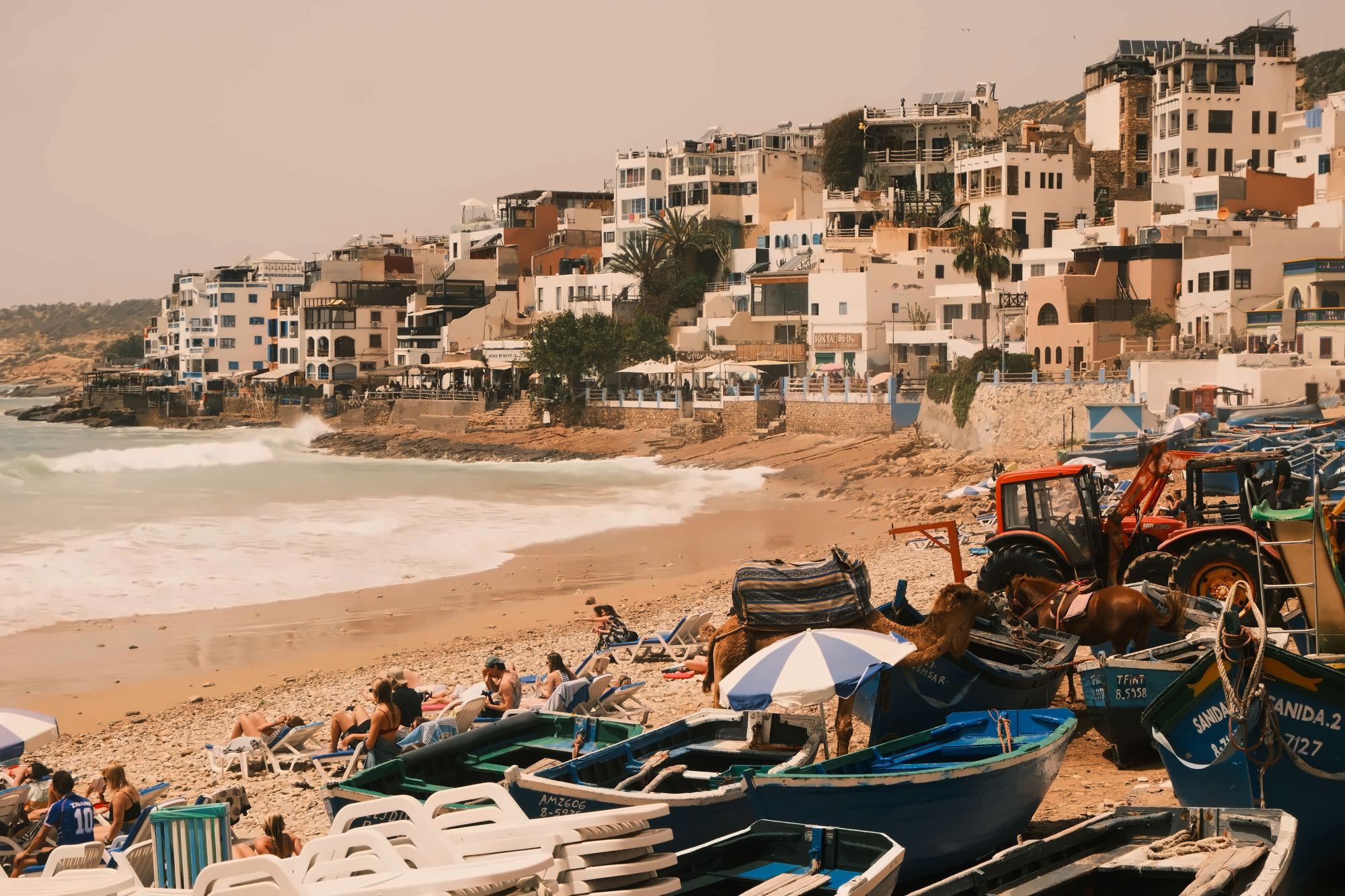Turquoise natural pools of Paradise Valley set among pink rock and palm groves inland from Taghazout